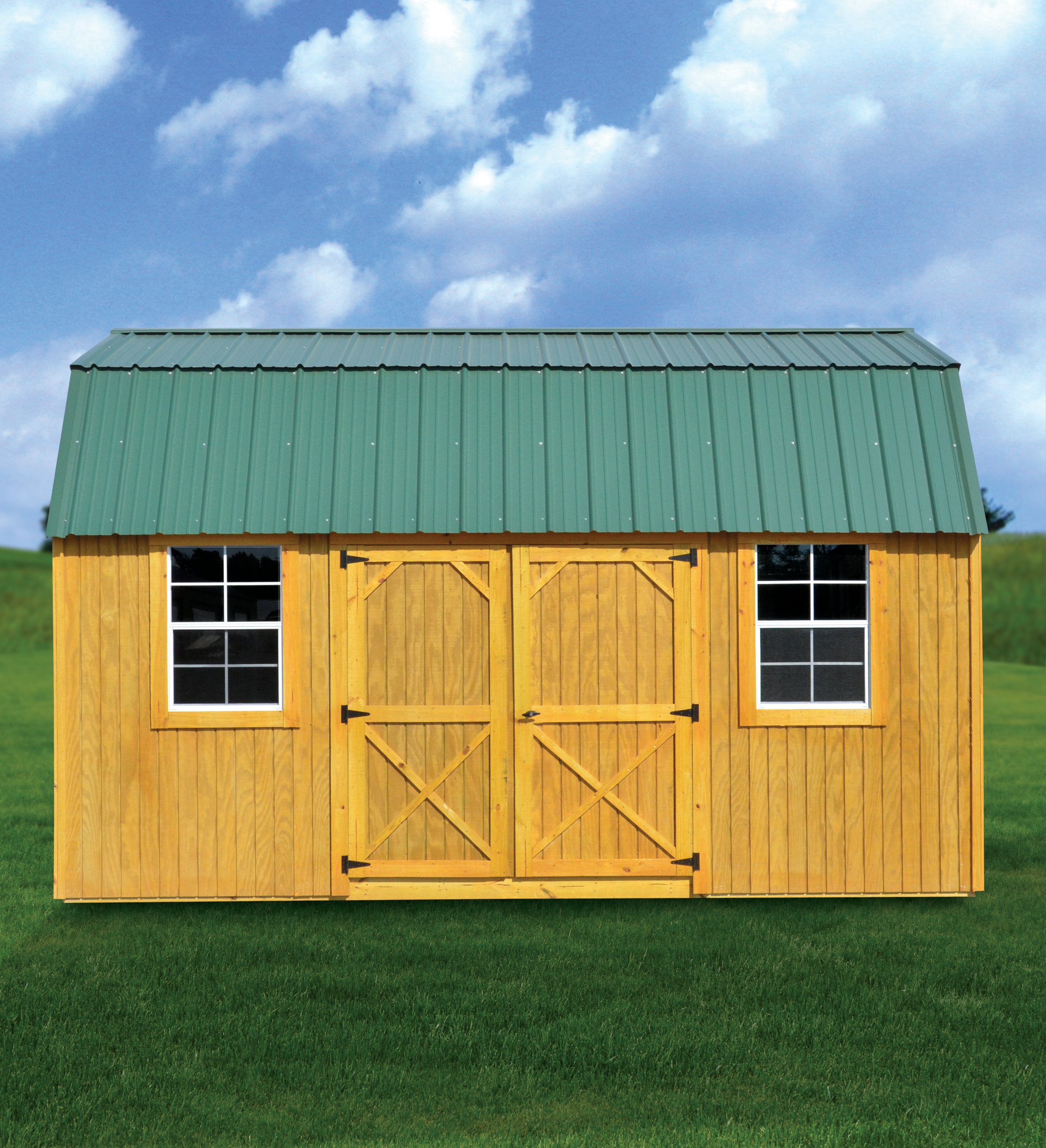 Derksen treated side lofted barn in yellow with green metal roof